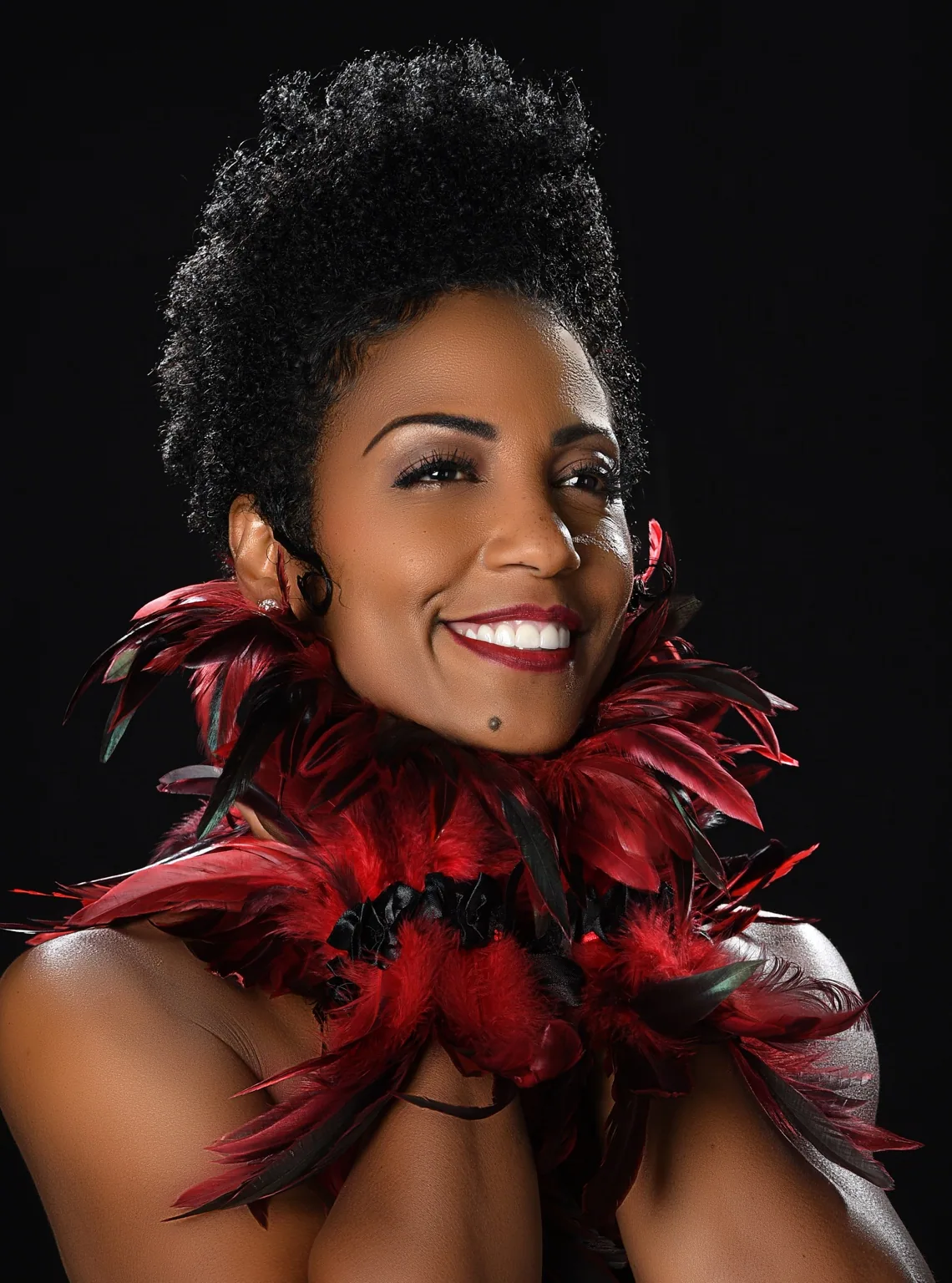 Yvette Spears portrait with red feathers