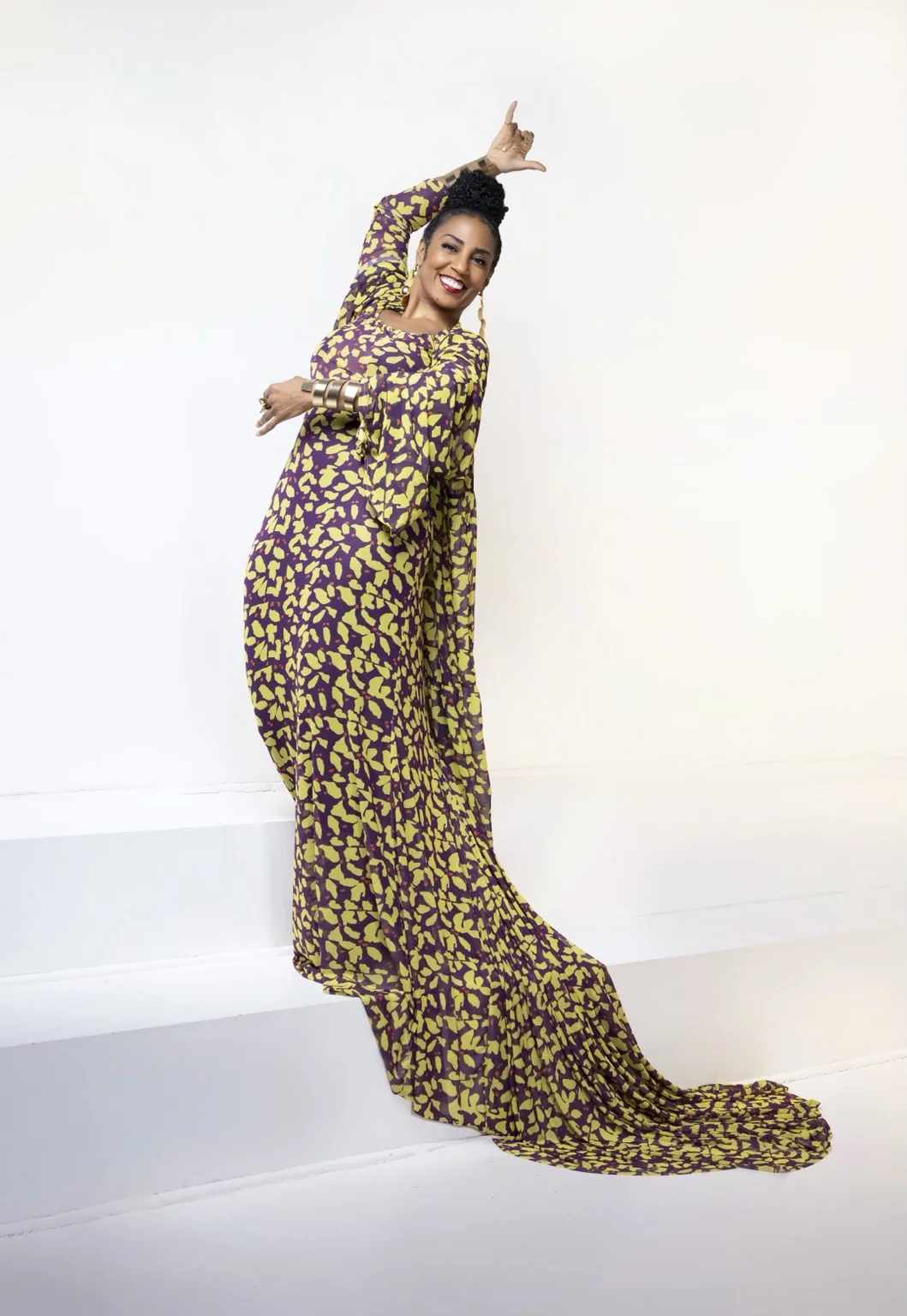Yvette Spears in a flowing purple and yellow gown